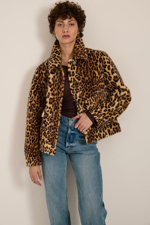 Leopard print faux fur utility jacket with faux suede collar, oversized flap pockets and relaxed silhouette.