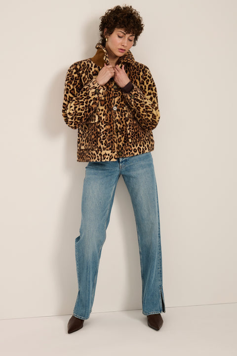 Leopard print faux fur utility jacket with faux suede collar, oversized flap pockets and relaxed silhouette.