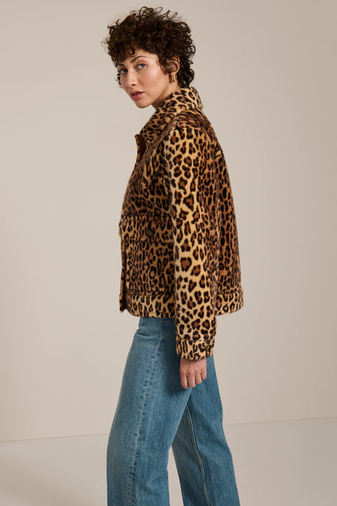 Leopard print faux fur utility jacket with faux suede collar, oversized flap pockets and relaxed silhouette.