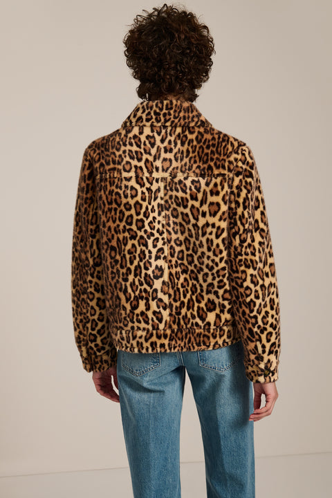 Leopard print faux fur utility jacket with faux suede collar, oversized flap pockets and relaxed silhouette.