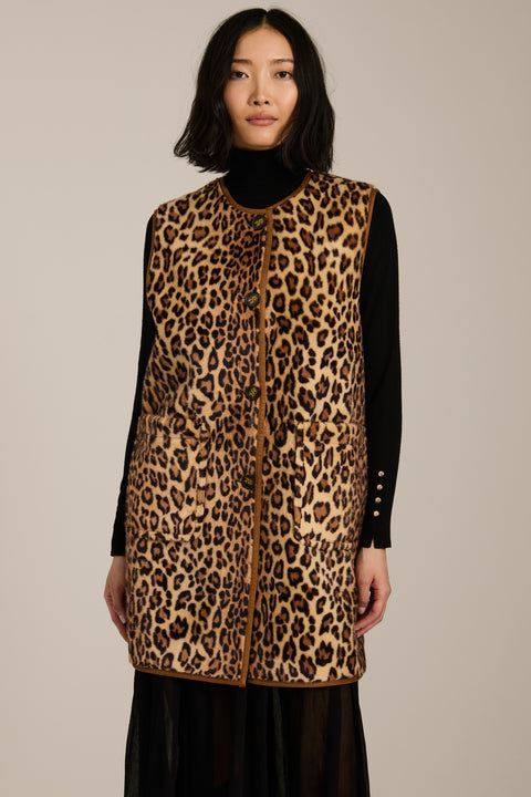Long leopard print faux fur vest with collarless silhouette, faux leather trim and streamlined fit.