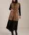 Long leopard print faux fur vest with collarless silhouette, faux leather trim and streamlined fit.