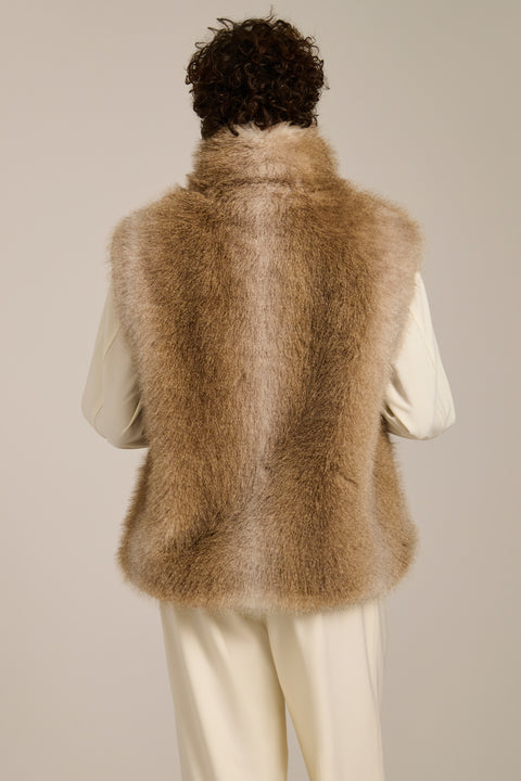 Plush faux fur vest with oversized stand collar, hidden front closure and side seam pockets.
