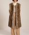 Brown-tipped faux fur long vest with collarless neckline, hook-and-eye closure and side seam pockets.