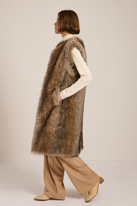 Brown-tipped faux fur long vest with collarless neckline, hook-and-eye closure and side seam pockets.