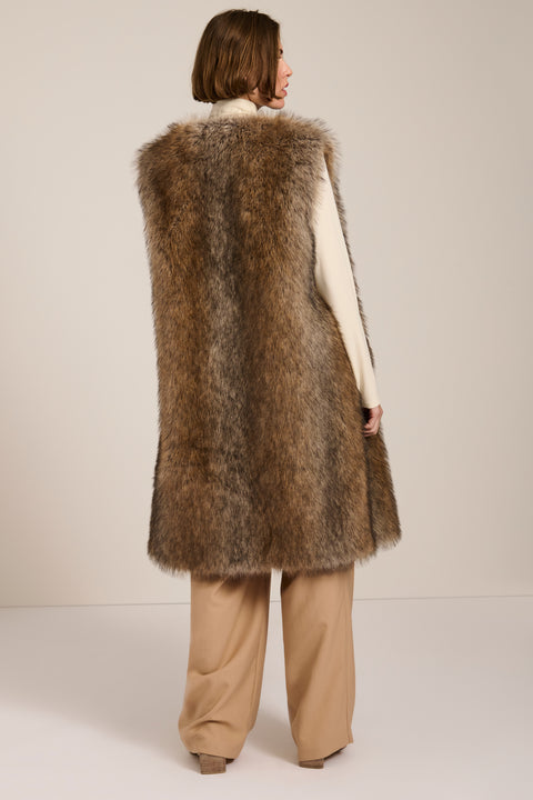 Brown-tipped faux fur long vest with collarless neckline, hook-and-eye closure and side seam pockets.