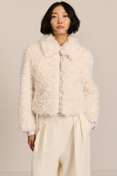 women's curly Faux Fur Jacket in chocolate brown with a cropped silhouette, textured faux fur and zip front.