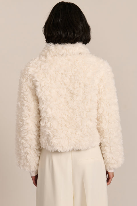 women's curly Faux Fur Jacket in chocolate brown with a cropped silhouette, textured faux fur and zip front.