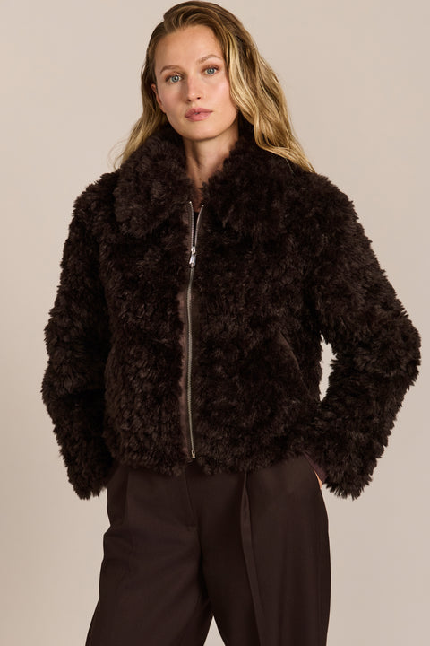 women's curly Faux Fur Jacket in chocolate brown with a cropped silhouette, textured faux fur and zip front.