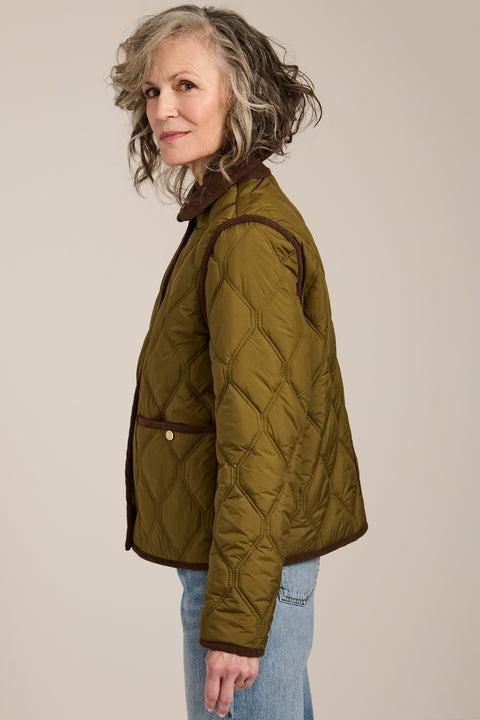 Women's quilted jacket with corduroy collar, snap-front closure, and patch pockets in olive green