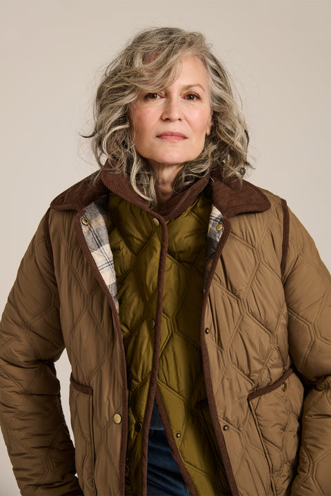 Women's quilted jacket with corduroy collar, snap-front closure, and patch pockets in olive green