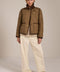 Women's quilted jacket with corduroy collar, snap-front closure, and patch pockets in olive green