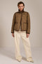Women's quilted jacket with corduroy collar, snap-front closure, and patch pockets in olive green