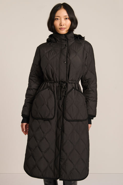 women's Long Quilted Puffer Coat with drawstring waist, hood, diamond quilting and longline silhouette.