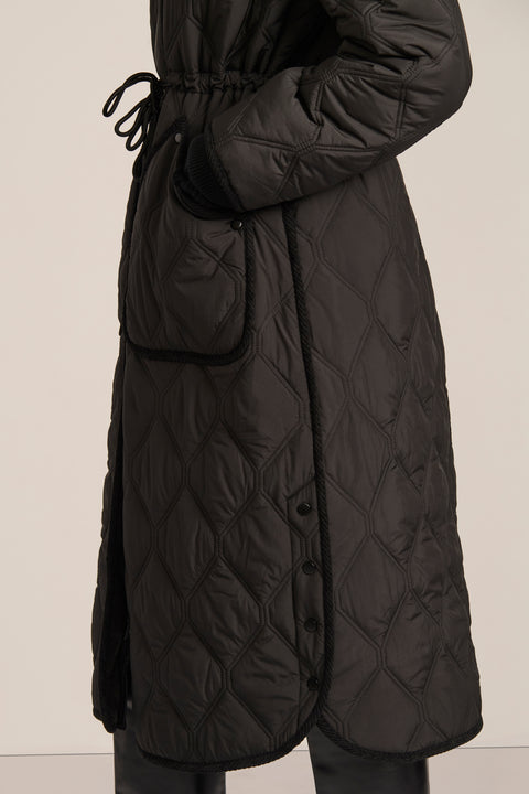 women's Long Quilted Puffer Coat with drawstring waist, hood, diamond quilting and longline silhouette.