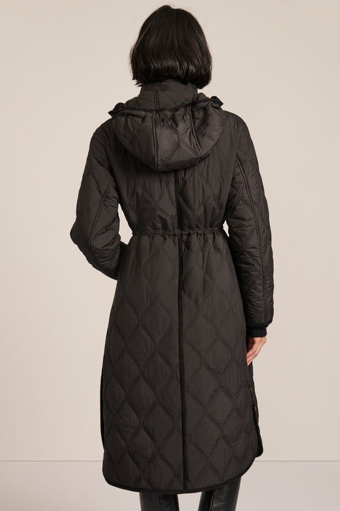 women's Long Quilted Puffer Coat with drawstring waist, hood, diamond quilting and longline silhouette.