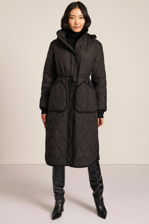 women's Long Quilted Puffer Coat with drawstring waist, hood, diamond quilting and longline silhouette.