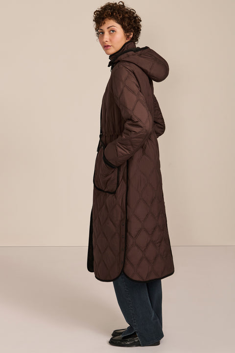 women's Long Quilted Puffer Coat with drawstring waist, hood, diamond quilting and longline silhouette.