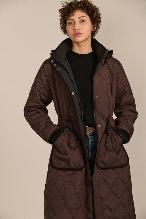 women's Long Quilted Puffer Coat with drawstring waist, hood, diamond quilting and longline silhouette.