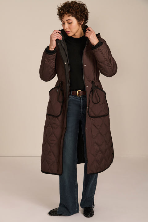 women's Long Quilted Puffer Coat with drawstring waist, hood, diamond quilting and longline silhouette.