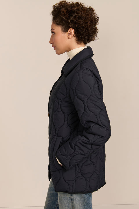 women's Quilted Jacket with onion quilting, pointed collar, button front and a softly shaped waist.