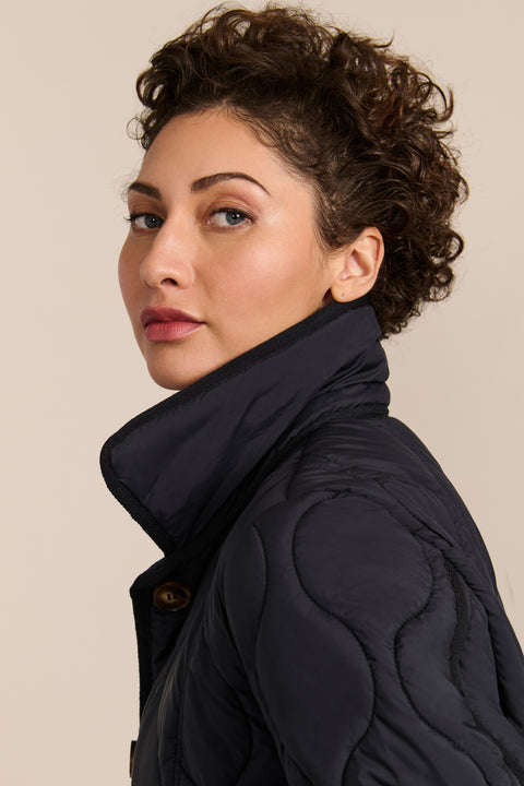 women's Quilted Jacket with onion quilting, pointed collar, button front and a softly shaped waist.