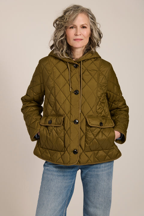 Women's diamond quilted hooded jacket with drawcord waist and oversized patch pockets.