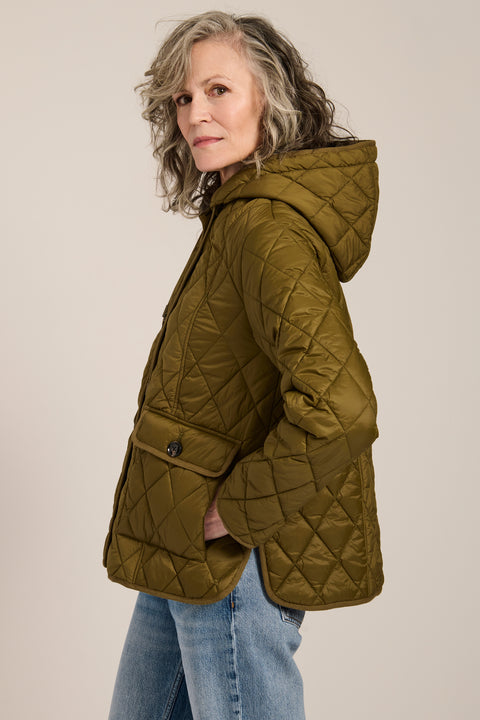 Women's diamond quilted hooded jacket with drawcord waist and oversized patch pockets.
