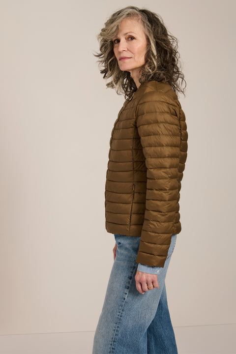 Lightweight packable quilted jacket with crew neckline, recycled insulation and zippered pockets.