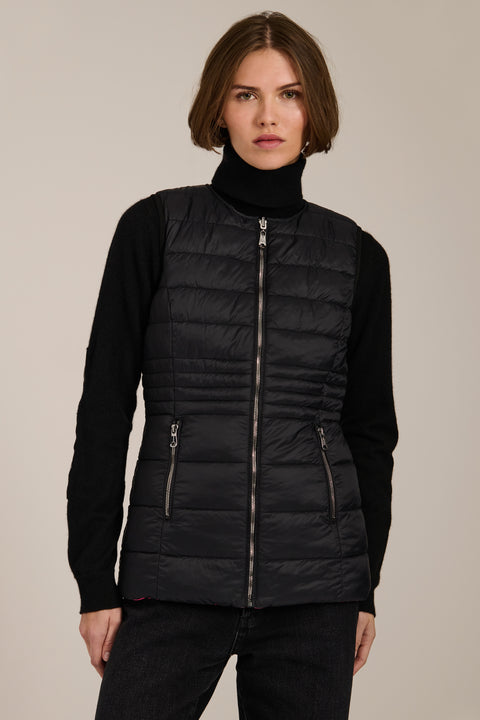 women's reversible black and pink puffer vest.