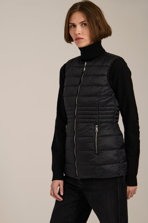 women's reversible black and pink puffer vest.