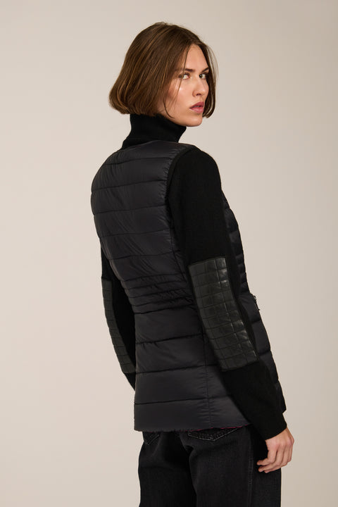 women's reversible black and pink puffer vest.