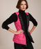women's reversible black and pink puffer vest.