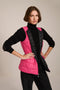 women's reversible black and pink puffer vest.