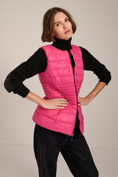 women's reversible black and pink puffer vest.