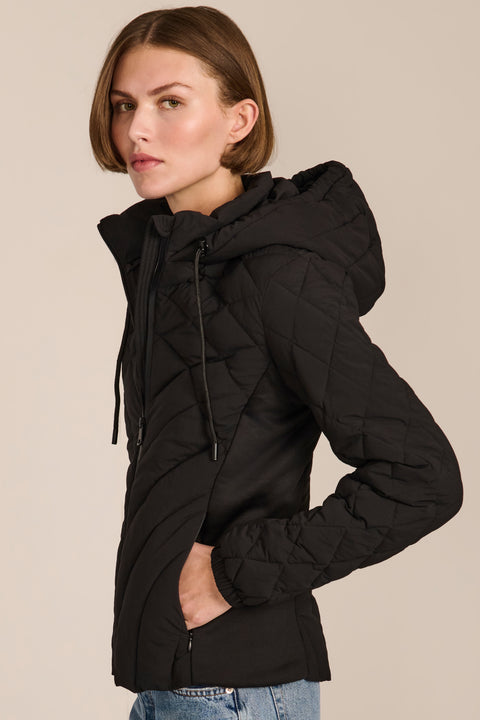 women's Quilted Puffer Jacket with geometric quilting, neoprene side panels, drawstring hood and contrast black zipper.