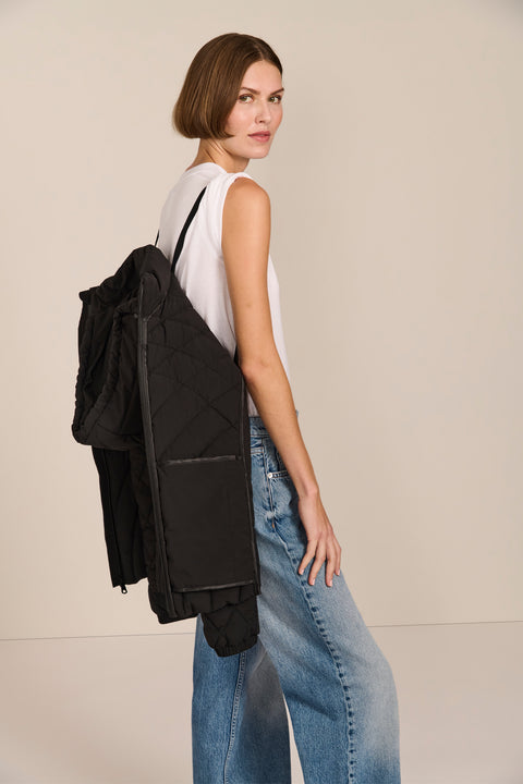 women's Quilted Puffer Jacket with geometric quilting, neoprene side panels, drawstring hood and contrast black zipper.