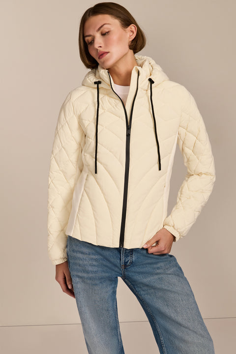 women's Quilted Puffer Jacket with geometric quilting, neoprene side panels, drawstring hood and contrast black zipper.