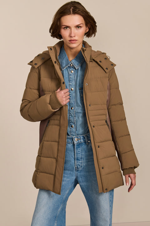 women's hooded puffer coat with horizontal quilting, flexible neoprene side panels, high collar and zip pockets.