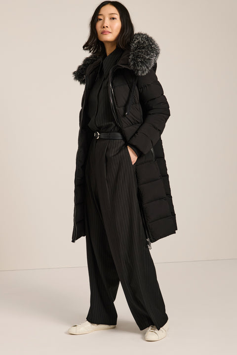 Mid-length hooded puffer coat with faux fur trim, faux leather trim, zip pockets and elastic back waist.