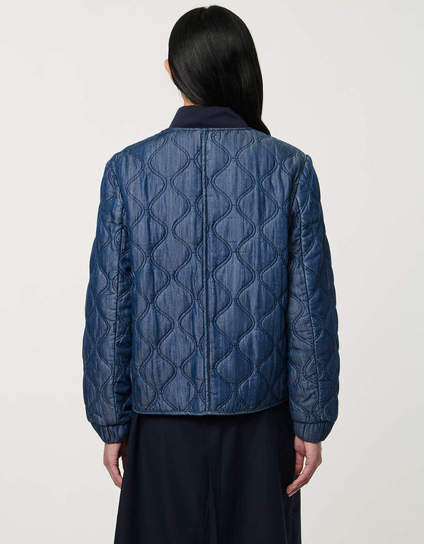 Women’s quilted denim bomber jacket with front patch pockets and contrast ribbed trim.