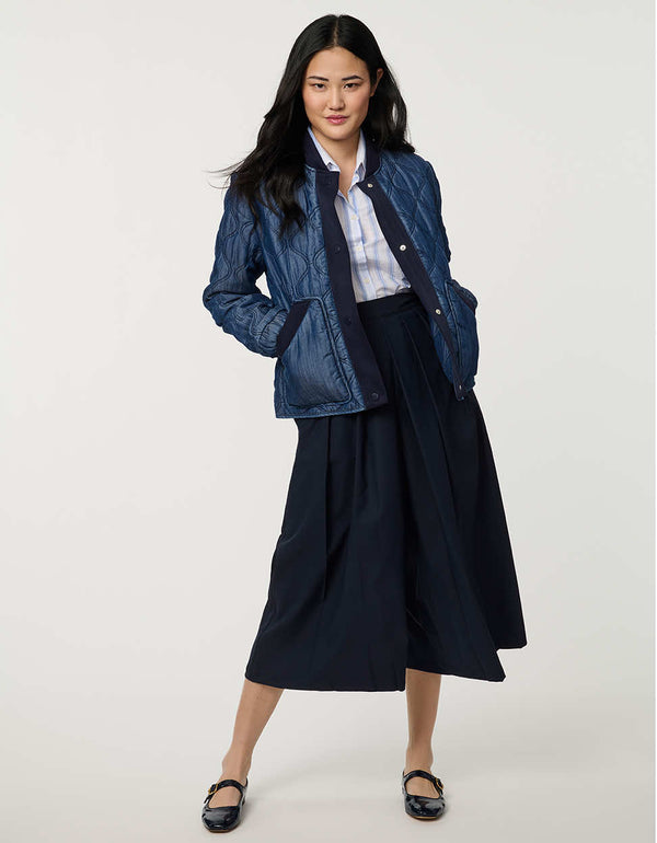 Women’s quilted denim bomber jacket with front patch pockets and contrast ribbed trim.