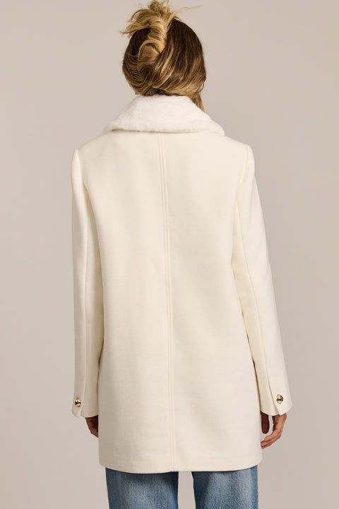 women's wool coat featuring a removable faux fur collar, gold-tone button-front closure and flap pockets.