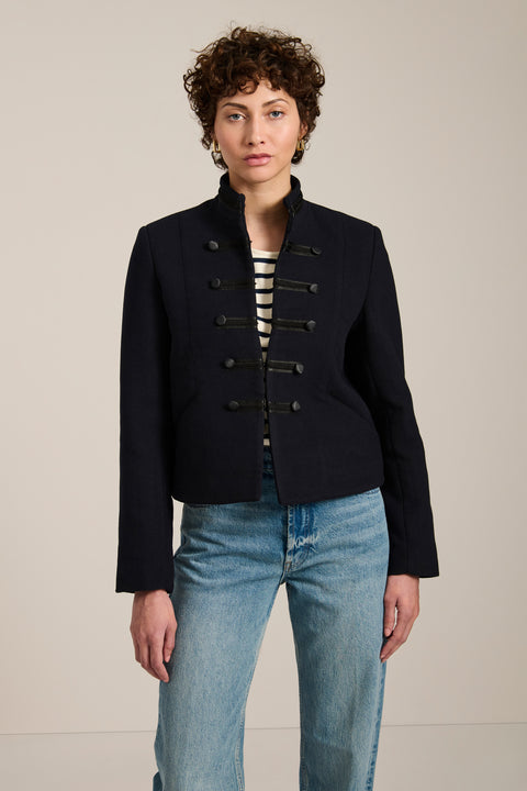 Military-inspired jacket with stand collar, tonal hook closures, angled welt pockets and tailored silhouette.