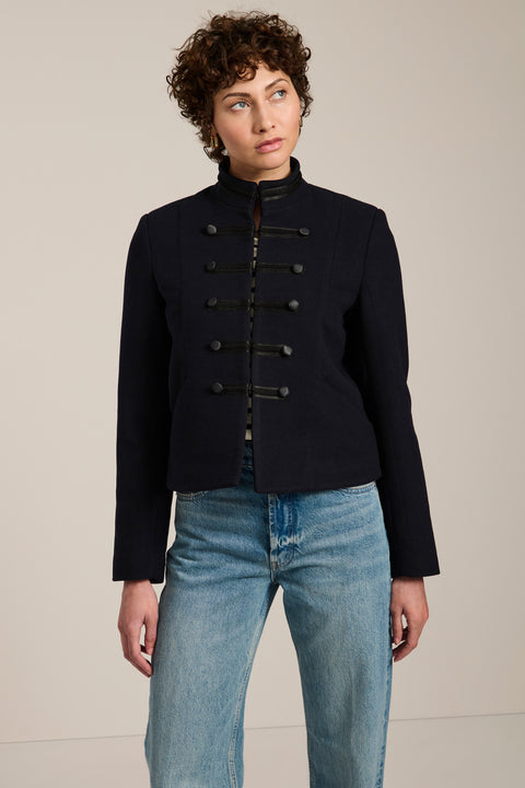 Military-inspired jacket with stand collar, tonal hook closures, angled welt pockets and tailored silhouette.