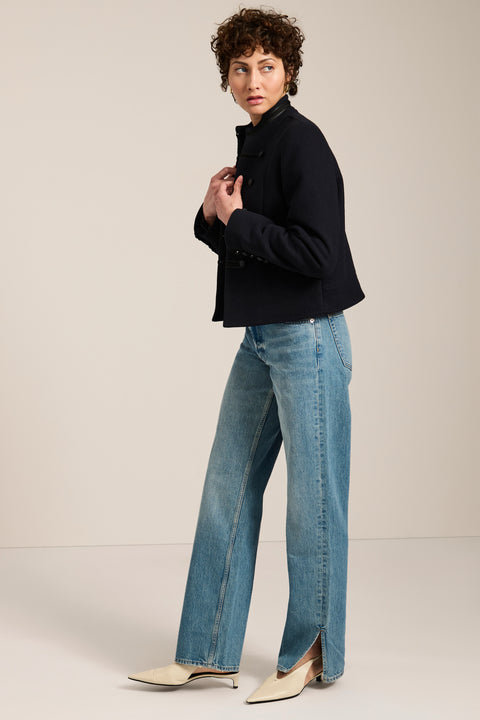 Military-inspired jacket with stand collar, tonal hook closures, angled welt pockets and tailored silhouette.