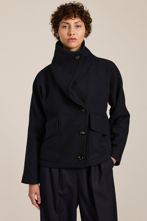 Women's wool-blend wrap jacket with oversized convertible collar and patch pockets.