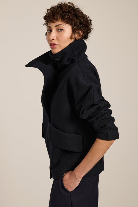 Women's wool-blend wrap jacket with oversized convertible collar and patch pockets.
