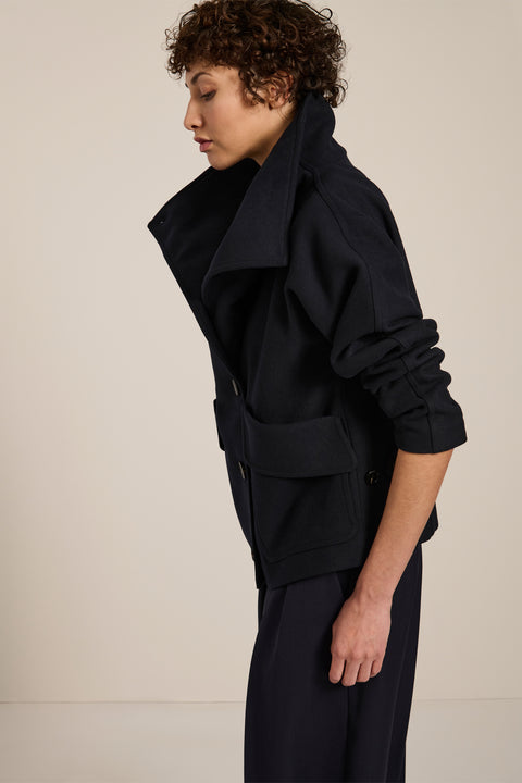 Women's wool-blend wrap jacket with oversized convertible collar and patch pockets.