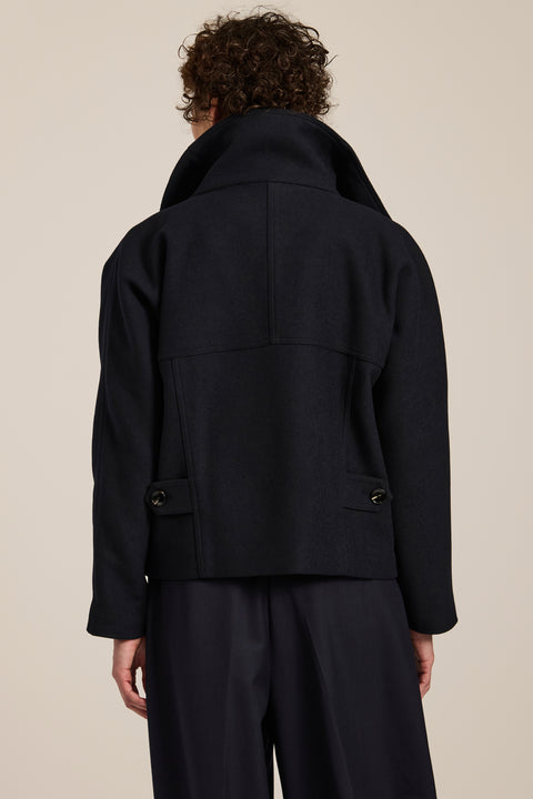 Women's wool-blend wrap jacket with oversized convertible collar and patch pockets.
